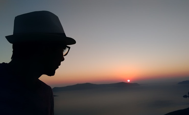 Picture of Kaleb overlooking the santorini caldera in Greece